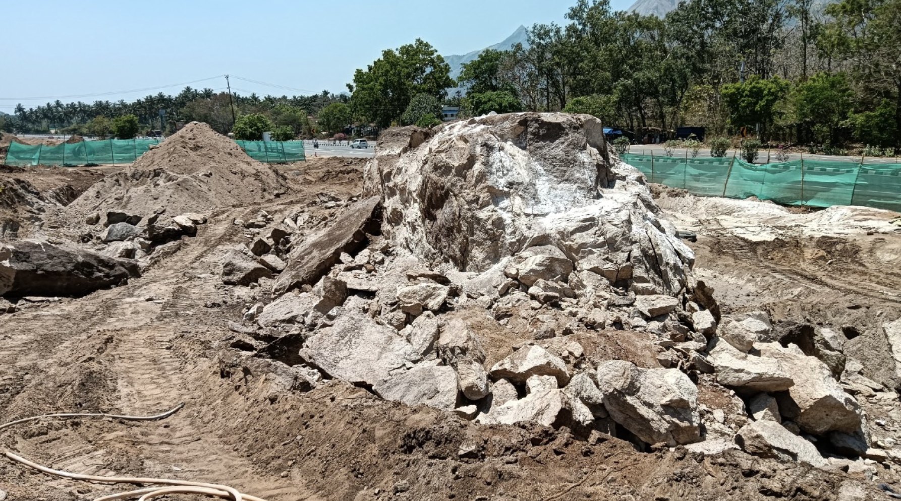 Rock and cleared ground at the project site