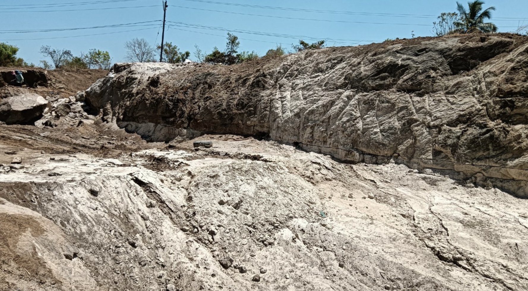 Wide view of an exposed rock face at the project site
