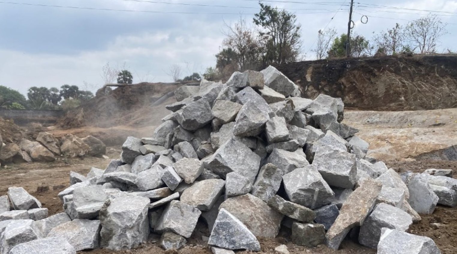 Pile of excavated stone at the project site